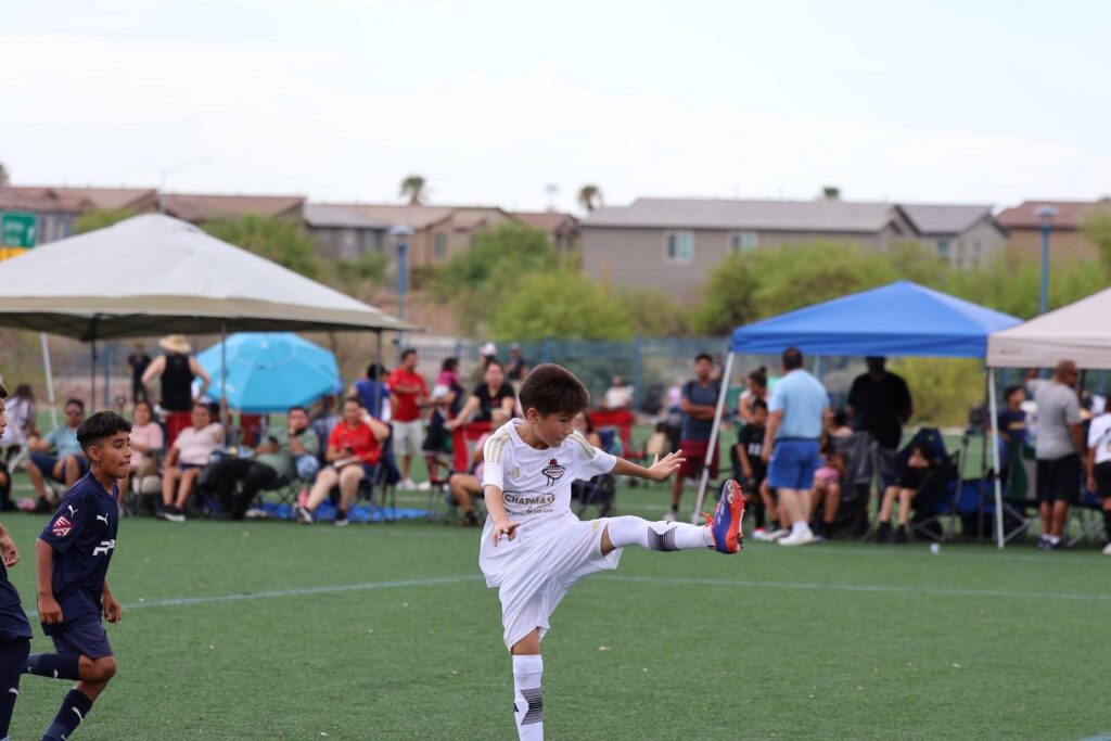kid kicking a ball